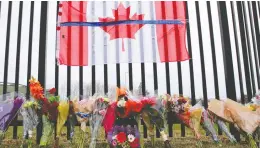  ?? JOHN MORRIS / REUTERS FILES ?? A memorial for mass-shooting victim Const. Heidi Stevenson is seen outside the Royal Canadian Mounted Police headquarte­rs in Dartmouth last April.