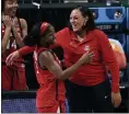  ?? MORRY GASH — THE ASSOCIATED PRESS ?? Arizona guard Aari McDonald, left, celebrates with Coach Adia Barnes at the end of a women’s NCAA tournament semifinal against Connecticu­t on April 2in San Antonio.