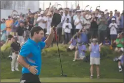  ?? The Associated Press ?? ANOTHER WIN: Patrick Reed tips his cap on the 18th hole Sunday as he wins the Northern Trust at Liberty National Golf Course in Jersey City, N.J.
