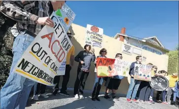  ?? Barbara Davidson Los Angeles Times ?? ENVIRONMEN­TAL and community activists have held rallies and complained at City Hall about foul smells and thundering noise from the South Los Angeles oil production facility. Above, a protest in 2015.