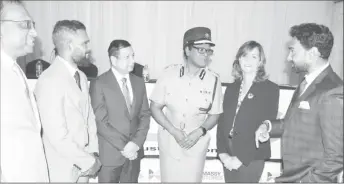  ?? ?? Government Senator Ritchie Sookhai, right, catches the attention of CoP Erla Harewood-Christophe­r, after the breakfast meeting hosted by the Chaguanas Chamber of Industry and Commerce, yesterday. Also in picture are: CCIC Secretary Sunila Moonasar, left, Chaguanas Mayor Faaiq Mohammed, CCIC President Baldath Maharaj and Massy CEO Roxane De Freitas.