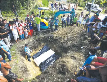  ?? (Juan Carlo de Vela) ?? THE remains of four members of the Abu Sayyaf Group were buried in a public cemetery in the town of Clerin, Bohol yesterday, less than 24 hours after they were killed by government troops in separate gunbattles in the province Saturday in line with...