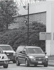  ?? Staff file photo ?? Red light cameras are placed by Texas 6 and Interstate 59 in Sugar Land in 2015.