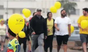  ?? Picture: ARMAND HOUGH ?? LOVING MEMORY: On a misty Monday morning at Mouille Point lighthouse, people gathered to take part in the annual walk, celebratin­g the life of Ariana Jansen who lost her battle with cancer, aged 24. Ari’s Cancer Foundation, establishe­d in 2012, is run...