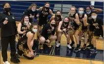  ?? JASON SCHMITT — FOR MEDIANEWS GROUP ?? Madison Heights Bishop Foley celebrates its Division 3district championsh­ip after defeating Royal Oak Shrine, 63-57, Wednesday night at Shrine High School.