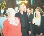  ?? BOB CHILD / AP ?? Former President George H.W. Bush looks up toward his portrait that is hung on the wall in Yale Commons, a large dining hall at Yale University in New Haven, Friday, May 29, 1998. Bush was attending a 50th reunion luncheon of his Yale class and...