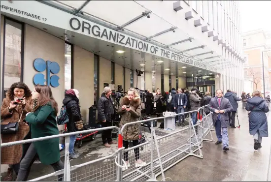  ??  ?? In this file photo dated March 6, 2020, before the coronaviru­s pandemic restrictio­ns, people stand outside the headquarte­rs of the Organizati­on of the Petroleum Exporting Countries, OPEC, in Vienna, Austria. Members of oil producer cartel OPEC and allied countries are meeting online Thursday March 4, 2021, considerin­g a possible increase in production now that prices have recovered to near their pre-pandemic levels. (AP)