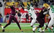  ?? GETTY IMAGES ?? Coach Herm Edwards said true freshman Jayden Daniels led the Sun Devils on long completion­s thanks to good one-on-one matchups with Oregon’s corners.