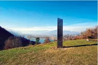  ?? ROBERT IOSUB/ASSOCIATED PRESS FILE PHOTO ?? A metal structure sticks out from the ground on the Batca Doamnei hill, outside Piatra Neamt in northern Romania, last month. Similar installati­ons are appearing around the world.