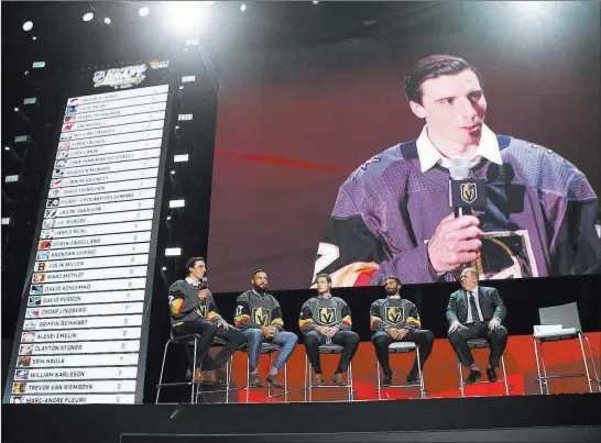  ?? Chase Stevens ?? Las Vegas Review-journal @csstevensp­hoto With his teammates, from left, Deryk Engelland, Brayden Mcnabb and Jason Garrison all ears, goaltender Marc-andre Fleury speaks on the big screen after the draft.