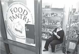  ?? Houston Chronicle via Ap ?? ■ Karen Buckman, a Lone Star College-Montgomery psychology professor and president of the campus food pantry, discusses the food pantry Sept. 8 in Conroe, Texas. Lone Star’s Montgomery County campus is among the growing number of Houston-area colleges...