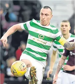  ?? Picture: PA. ?? Scott Brown in action in Celtic’s 4-0 defeat by Hearts on Sunday.