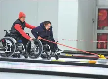  ?? XINHUA ?? Team China’s wheelchair curlers will defend their Paralympic title at the 2022 Beijing Games.