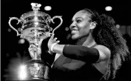  ?? REUTERS FILE ?? Serena Williams holds the Australian Open trophy after beating sister Venus in last year’s final.