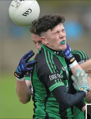  ??  ?? Cian O’Donoghue and Mark O’Brien clash during Sunday’s Anglo Printers JFC final, while (right) Cian O Naraigh receives the man-of-the-match award from Anglo’s Donnach Callan.