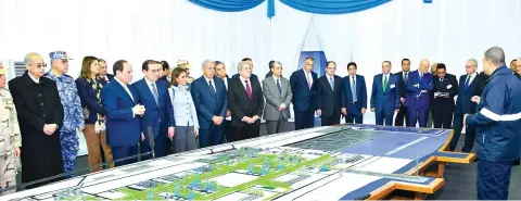  ??  ?? Egyptian President Abdel Fattah El-Sisi looks at mockups of natural gas extraction facilities during the inaugurati­on of the offshore Zohr gas field in the northern Suez canal city of Port Said. (AFP)