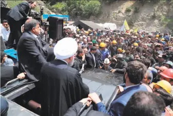 ?? Iranian presidency ?? Iranian President Hassan Rouhani stands through the roof of a sport utility vehicle to address coal miners in Azadshahr. An explosion at the mine Wednesday killed at least 35 people.