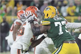  ?? GETTY IMAGES ?? Third-string left tackle Yosh Nijman has held his own against the Browns’ Myles Garrett and other pass rushers this season.