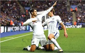  ?? UEFA.COM ?? TIRU TORRES: Selebrasi Alvaro Morata setelah membobol gawang Leicester City di Premier League (9/9/2017).