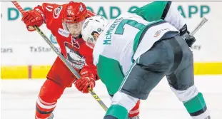  ?? TEXAS STARS PHOTO ?? Clark Bishop of the St. John’s takes a faceoff for the Charlotte Checkers against Mike Mcmurtry of the Texas Stars in an AHL game last season. Bishop is at the Carolina Hurricanes’ training camp, and is entering his second pro season.