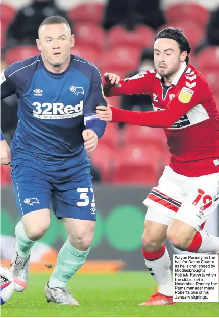  ??  ?? Wayne Rooney on the ball for Derby County as he is challenged by Middlesbro­ugh’s Patrick Roberts when the clubs met in November. Rooney the Rams manager made Roberts one of his January signings.