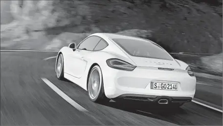  ?? Photog raphs by Porsche ?? THE 2014 CAYMAN’S taillights are bisected by a horizontal crease that connects to the automatica­lly deployable rear spoiler.