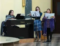  ?? ?? Bhing (right) sings during the English-language mass at Saint Blaise Catholic church in Zagreb, Croatia.