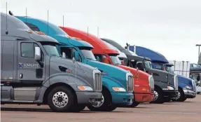  ?? 2009 PHOTO BY DAVID ZALUBOWSKI/AP ?? Big rigs stack up at the Flying J Truck Stop along Interstate 70 near the small Colorado plains community of Limon.