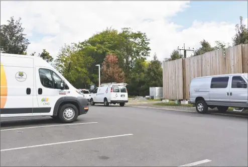  ?? Alexander Soule / Hearst Connecticu­t Media ?? Service vehicles for Avangrid subsidiary Connecticu­t Natural Gas in October in Greenwich. With oil prices down, home conversion­s to natural gas have slowed, with prices having spiked last winter during a cold snap.