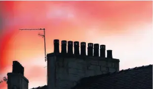  ??  ?? “The sunset on the summer solstice was lovely around the chimney pots on Clepington Road, Dundee,” says Eric Niven, who took the photograph.