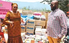  ?? ?? Women Affairs, Community, Small and Medium Enterprise­s Developmen­t Minister, Senator Monica Mutsvangwa hands over donations for the Mutasa District Safe Shelter to Minister of State for Manicaland Provincial Affairs and Devolution, Advocate Misheck Mugadza. The goods were donated by the United Nations family in Zimbabwe-Pictures: Tinai Nyadzayo