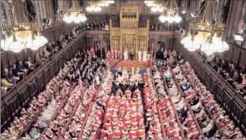  ?? Alastair Grant
Pool Photo ?? QUEEN ELIZABETH II and Prince Philip appear before Britain’s House of Lords in May. The Conservati­veled government wants to transform the unelected tradition-bound body into something akin to a Senate.