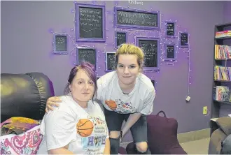  ?? TINA COMEAU PHOTO ?? Kelly Mitchell, mother of Aidaen Mae Mitchell, and Laura Hanlon, who was a friend of Aidaen's, inside the Aidaen Mae Mitchell Wellness Room that is a component of the Tri County Mental Health and Wellness drop-in centre at 101 Water St.