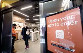  ?? AP FOTO ?? GRAB AND GO. The cashier-less Amazon Go store now has 20 convenienc­e stores in three cities in the US.