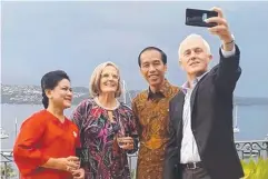  ??  ?? SELFIE: Prime Minister Malcolm Turnbull snaps a selfie with his wife Lucy and President Joko Widodo and Indonesia’s first lady Iriana.