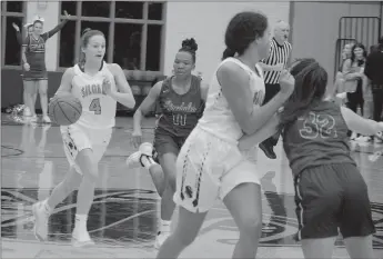  ?? Graham Thomas/Siloam Sunday ?? Siloam Springs senior Chloe Price brings the ball down the floor with Alma’s Ariel Towns-Robinson in pursuit Tuesday at Panther Activity Center. Price scored 18 points as the Lady Panthers defeated the Lady Airedales 56-45.