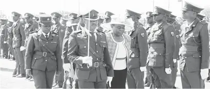  ??  ?? Bulawayo Metropolit­an Province Minister of State for Provincial Affairs, Judith Ncube, inspects a parade during the Zimbabwe Defence Forces celebratio­ns at White City Stadium in Bulawayo yesterday. (Picture Obey Sibanda)