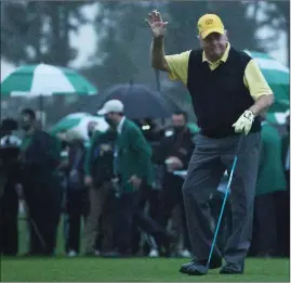  ??  ?? Jack Nicklaus waves to the fans as he takes his shot as honorary opener at Augusta National yesterday