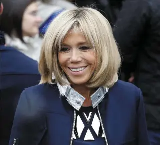  ??  ?? A new biography of the French president’s wife, Brigitte Macron, tells how she met her future husband Emmanuel when he was just 14 and she was 38 and she was shunned by friends when they later formed a relationsh­ip. ‘Brigitte Macron, L’Affranchie’ (the...