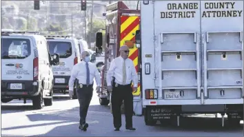  ?? PAUL BERSEBACH/THE ORANGE COUNTY REGISTER VIA AP ?? OFFICIALS WORK OUTSIDE THE SCENE of a shooting Thursday in Orange, Calif. The gunman who killed four people and wounded a fifth at an office complex knew all the victims either through business or personally, Southern California police said Thursday.