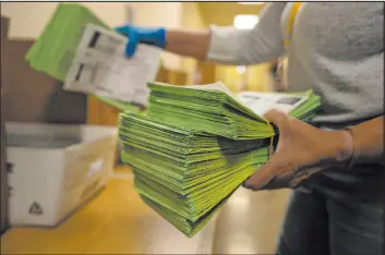  ?? Serkan Gurbuz
The Associated Press ?? An election official sorts mail ballots at the Maricopa County Tabulation and Election Center in Phoenix on March 5.