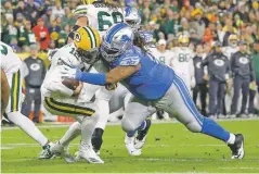  ?? JEFFREY PHELPS ASSOCIATED PRESS ?? Lions defensive tackle Damon Harrison sacks Packers quarterbac­k Aaron Rodgers during the second half.