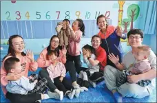  ?? PROVIDED TO CHINA DAILY ?? Doctors play with disabled children at the Ningxia Rehabilita­tion Center for the Disabled in Yinchuan, Ningxia Hui autonomous region, in April.