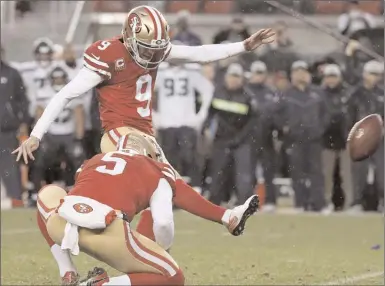  ?? The Associated Press ?? San Francisco 49ers kicker Robbie Gould (9) kicks a field goal from the hold of Bradley Pinion during overtime of an NFL football game to beat the Seattle Seahawks in Santa Clara, Calif., Sunday,