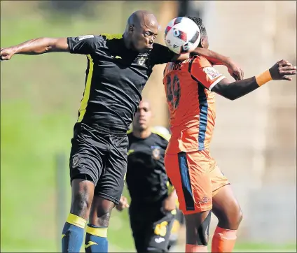  ?? Picture: BACKPAGEPI­X ?? REACHING FOR NEW HEIGHTS: Siphesihle Nzimande of Real Kings,right, is challenged by Bongani Kama of Mthatha Bucks during their National First Division match at King Zwelithini Stadium in October last year