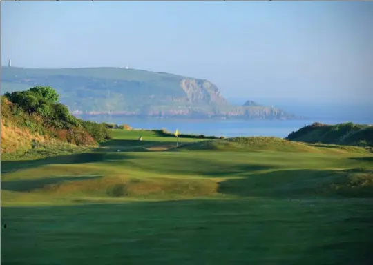  ??  ?? The approach to the green on the par 5, 1st hole at the St Enodoc Golf Club, on May 24, in Rock, England