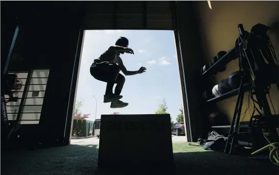  ?? — THE CANADIAN PRESS ?? A boy is silhouette­d as he does box jumps at a gym while taking part in the Wrap Project, which aims to steer youth away from gang influence by providing genuine mentors and opportunit­ies, such as help with schoolwork and employment.