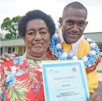  ?? Photo: Ronald Kumar ?? Inmate Vakeni Donu with grandmothe­r Mereoni Likuvecena following his graduation ceremony as 20 inmates graduated from the Nasinu Vocational Training School on December 2, 2022.