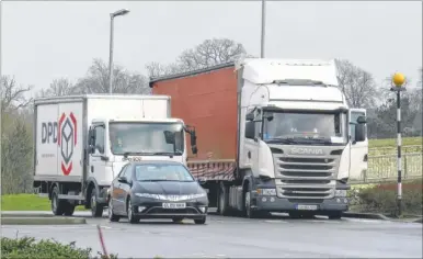  ??  ?? A foreign lorry creates problems in the entrance road to the Warren Retial Park in Ashford