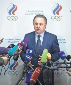  ?? PAVEL GOLOVKIN, AP ?? Russian sports minister Vitaly Mutko apologized for athletes and coaches in his country who have broken anti-doping rules.